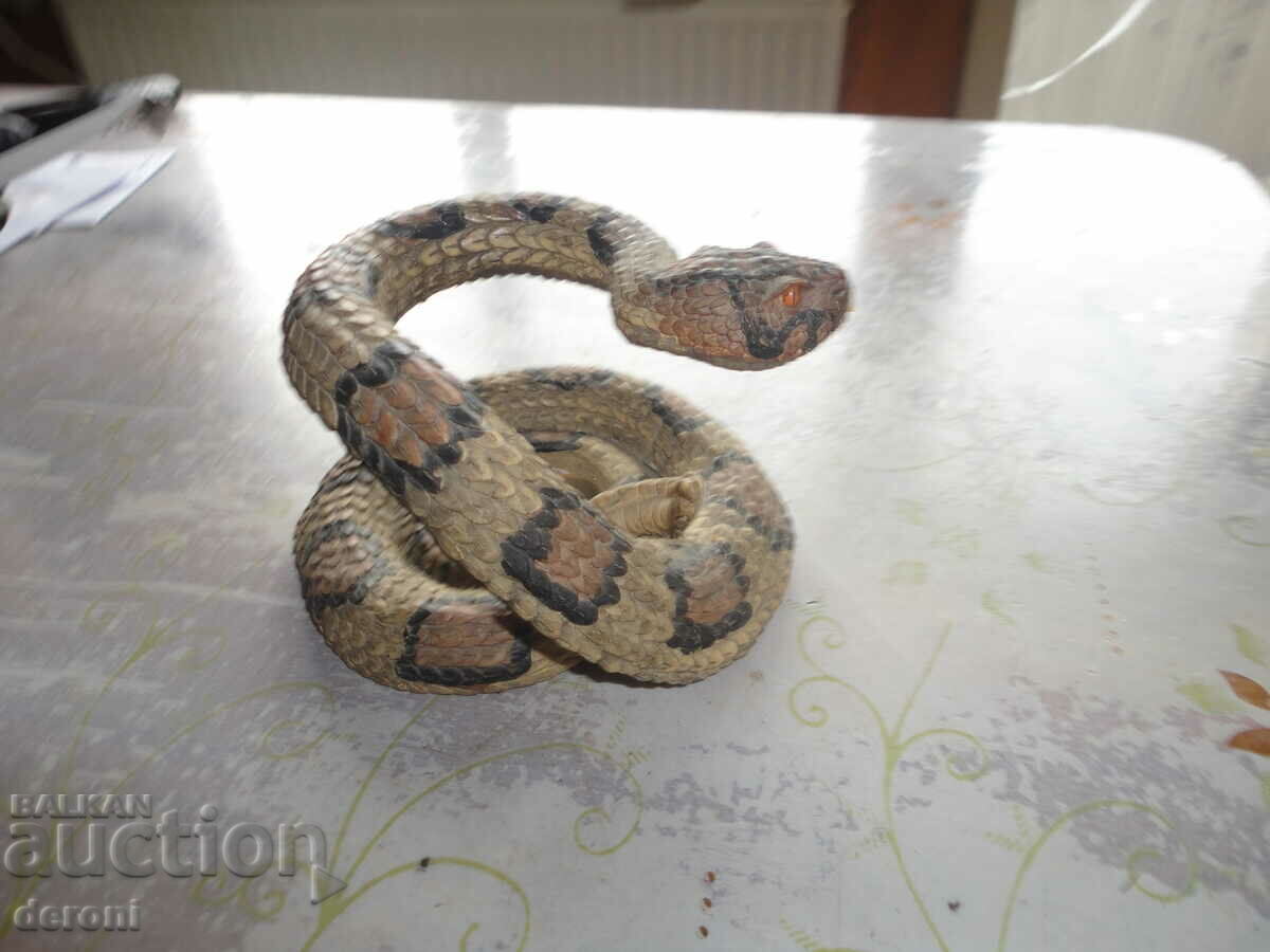 A sculpture of a rattlesnake figure - 7 A sculpture of a rattlesnake figure - 7