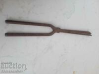 Old wrought iron curling iron