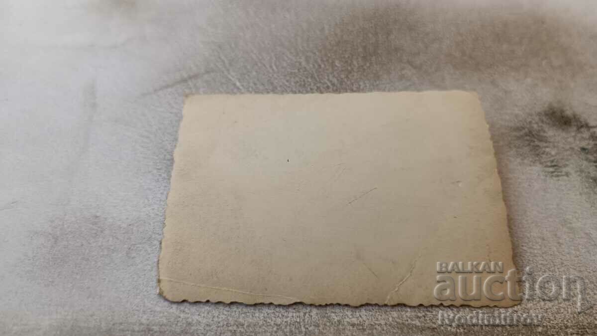 Photo Young men and women lying on the beach with price 1.45 BGN | € 0.74