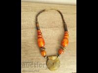 Old massive artificial amber necklace