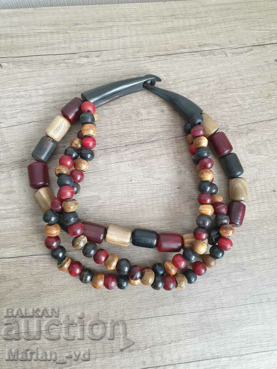 Old necklace made of bone, wood and artificial amber