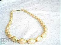old beautiful pearl necklace made of natural stone