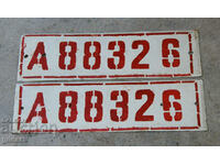 a pair of old military license plates