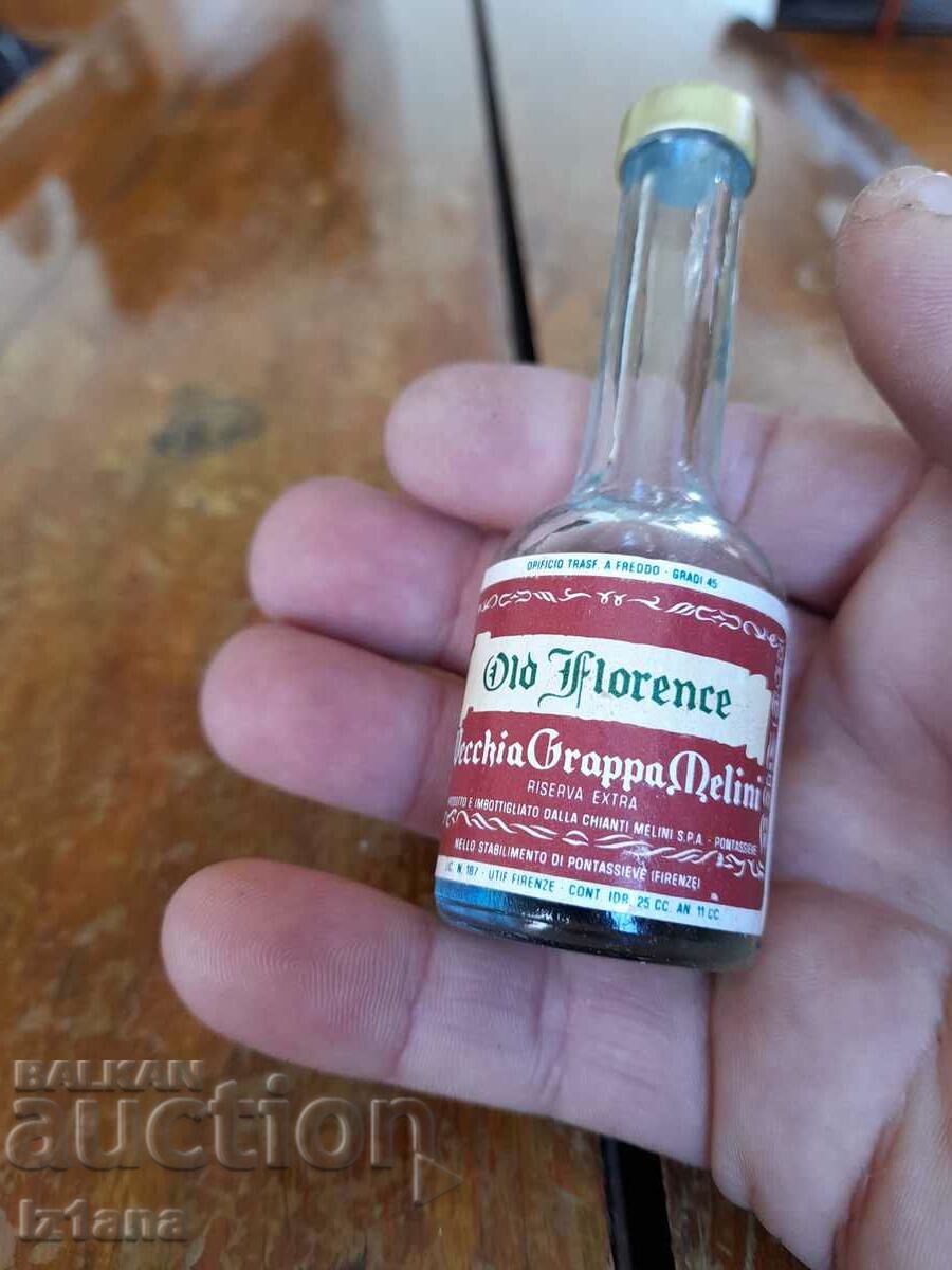 Licitație O sticlă veche de Grappa Melini