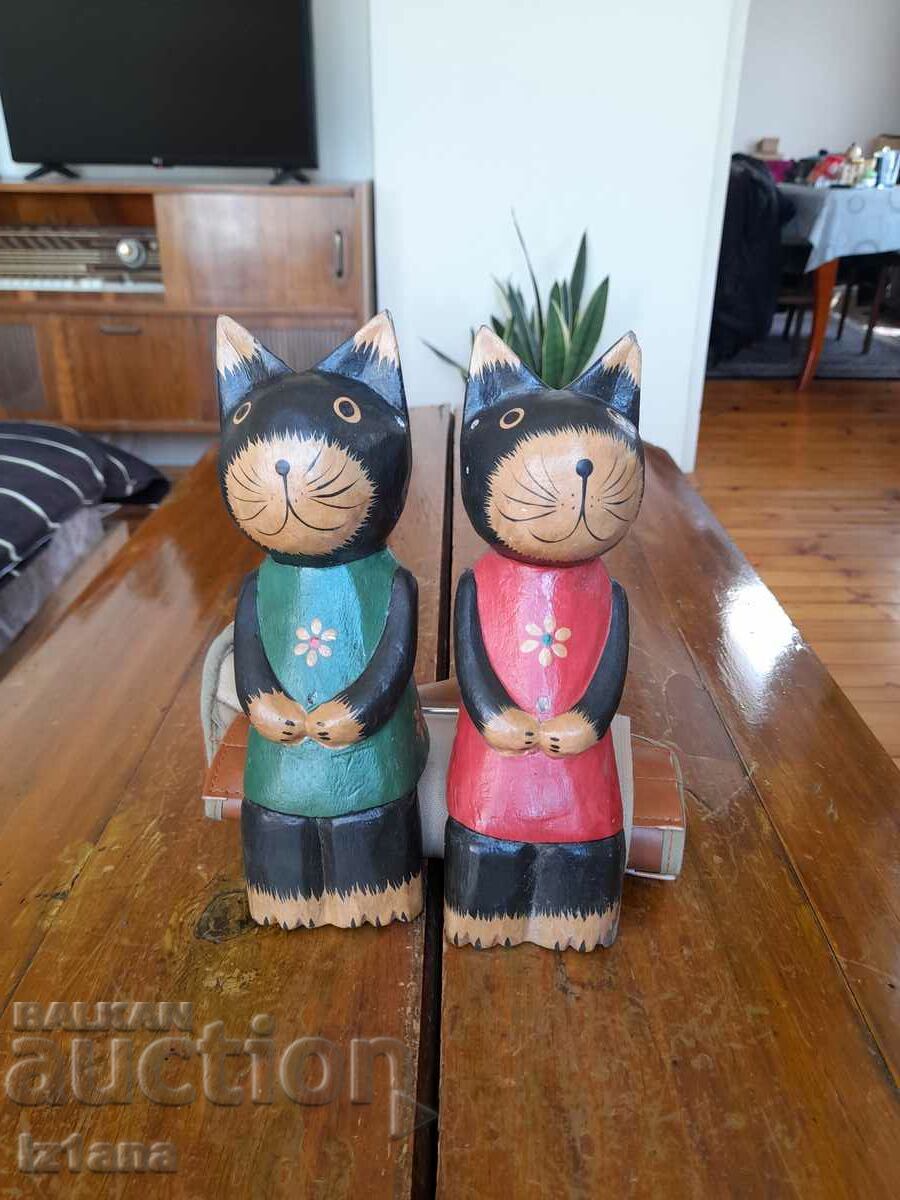 Wooden figurines of cats