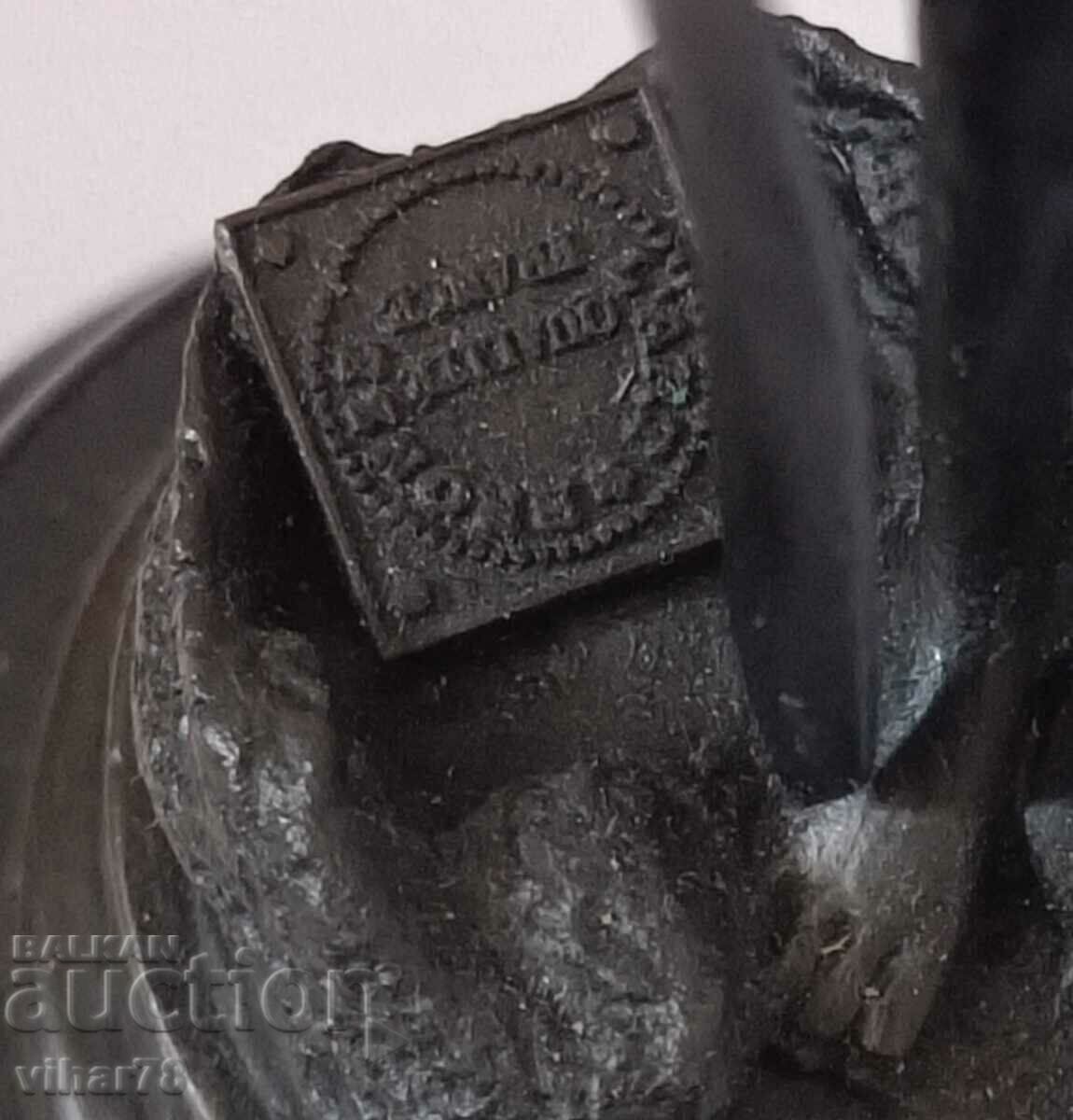 Auction Brass statuette Auction Brass statuette