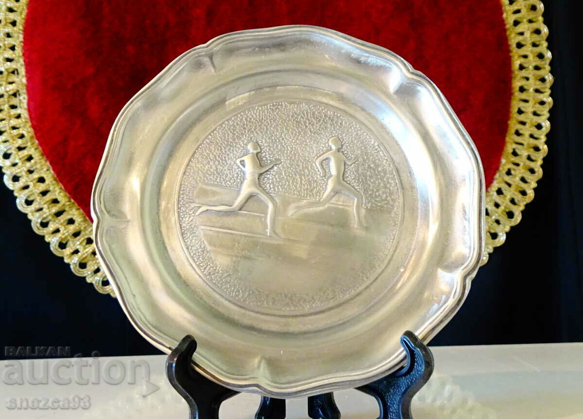 Pewter plate with sprinters.
