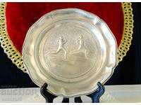 Pewter plate with sprinters.
