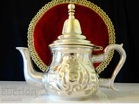 Arab teapot made of brass, relief.