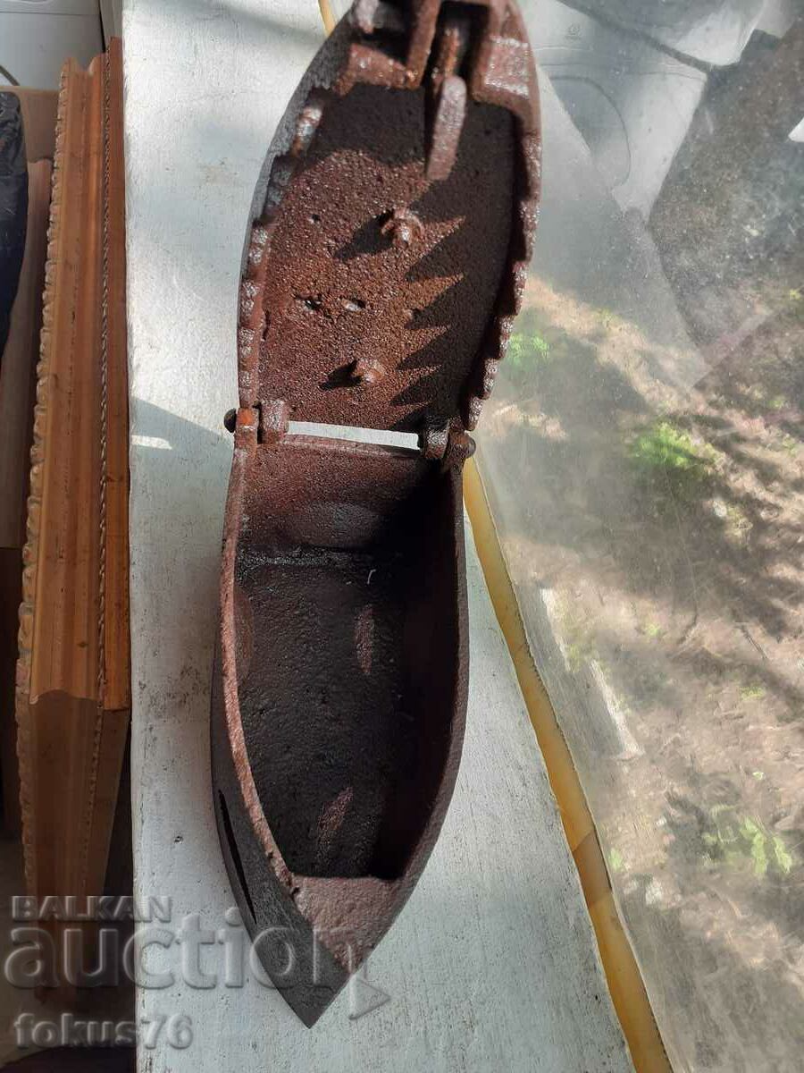 An old cast iron iron on fire - 6 An old cast iron iron on fire - 6