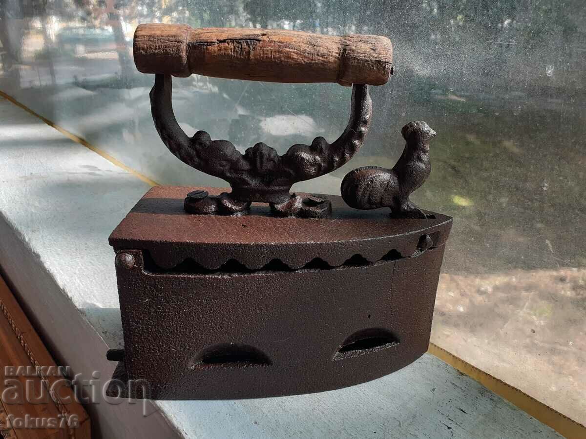 An old cast iron iron on fire An old cast iron iron on fire