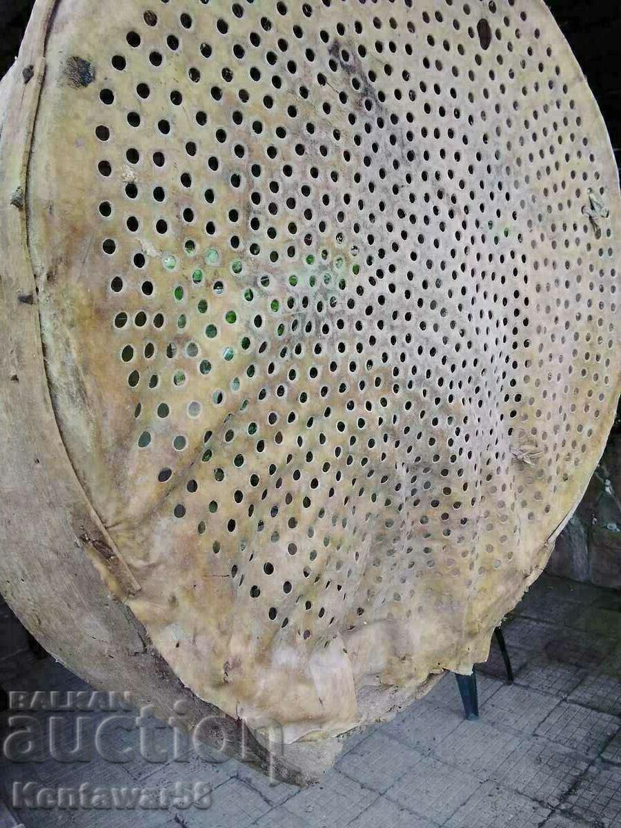 Auction  Antique wooden sieve with leather.