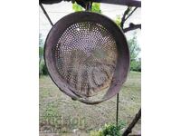 Antique wooden sieve with leather.