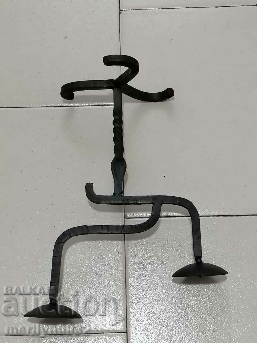 Auction  An old candle made of wrought iron lamp