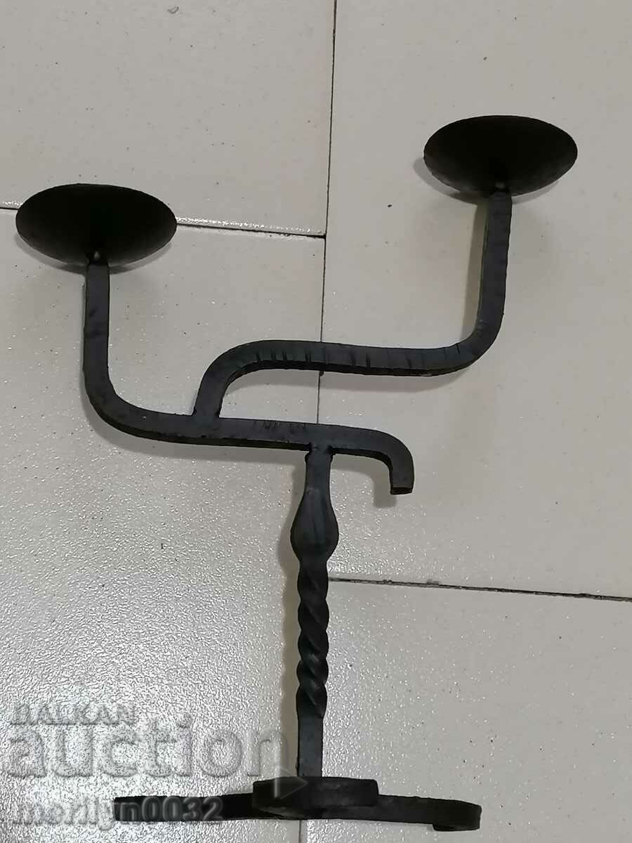 Delivery of An old candle made of wrought iron lamp