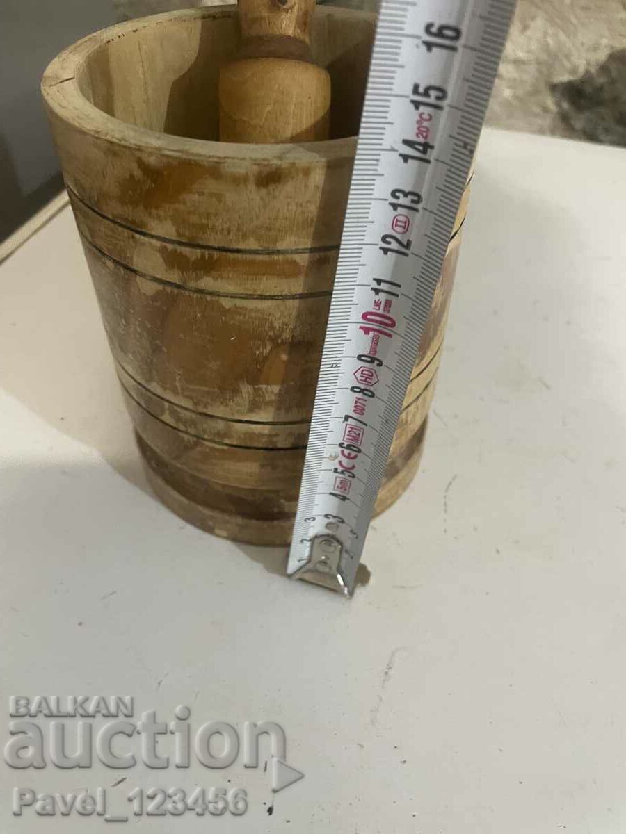 Delivery of A large, old, wooden mortar