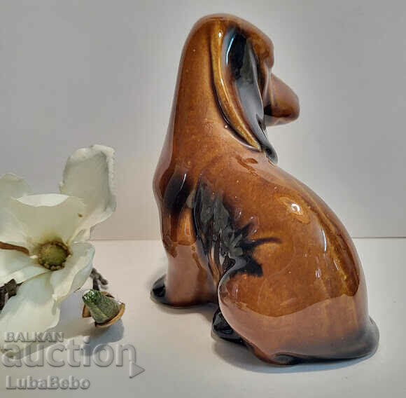 Auction Collectible porcelain figure of a Basset Hound. Auction Collectible porcelain figure of a Basset Hound.