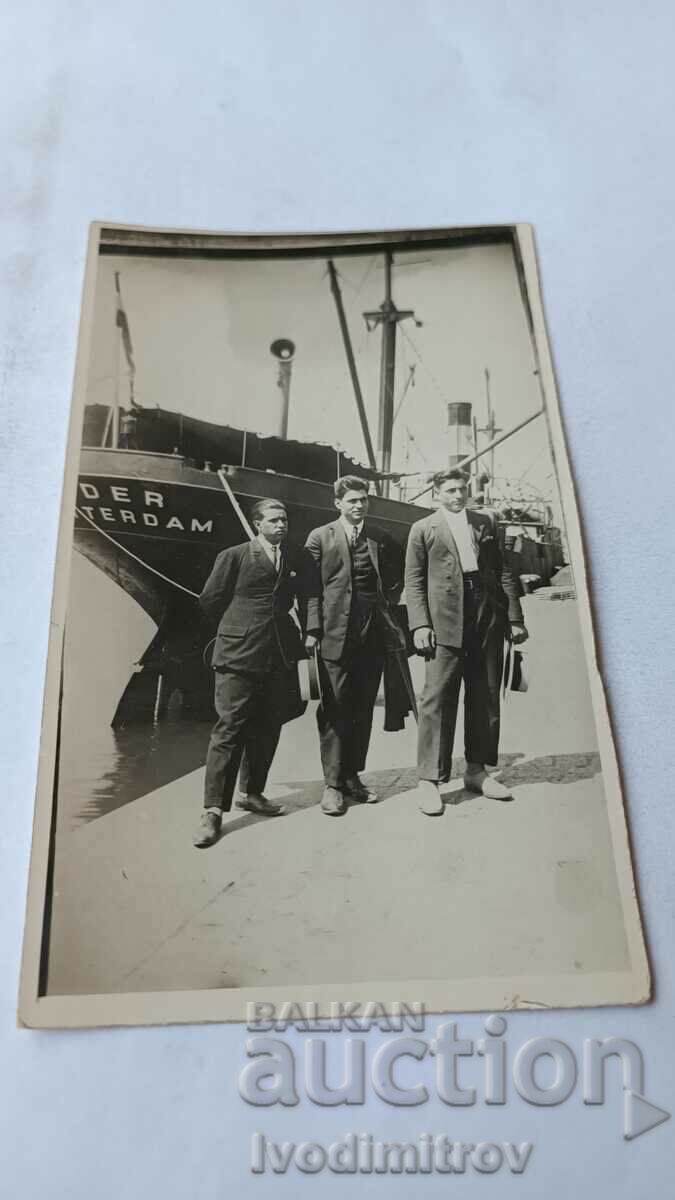 Photo Three young men at the port