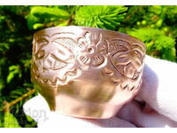 Copper cup with wrought ornaments.