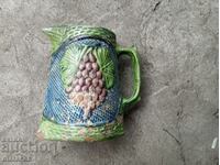 Old ceramic jug with enamel