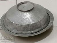 A copper renaissance saucer with a lid