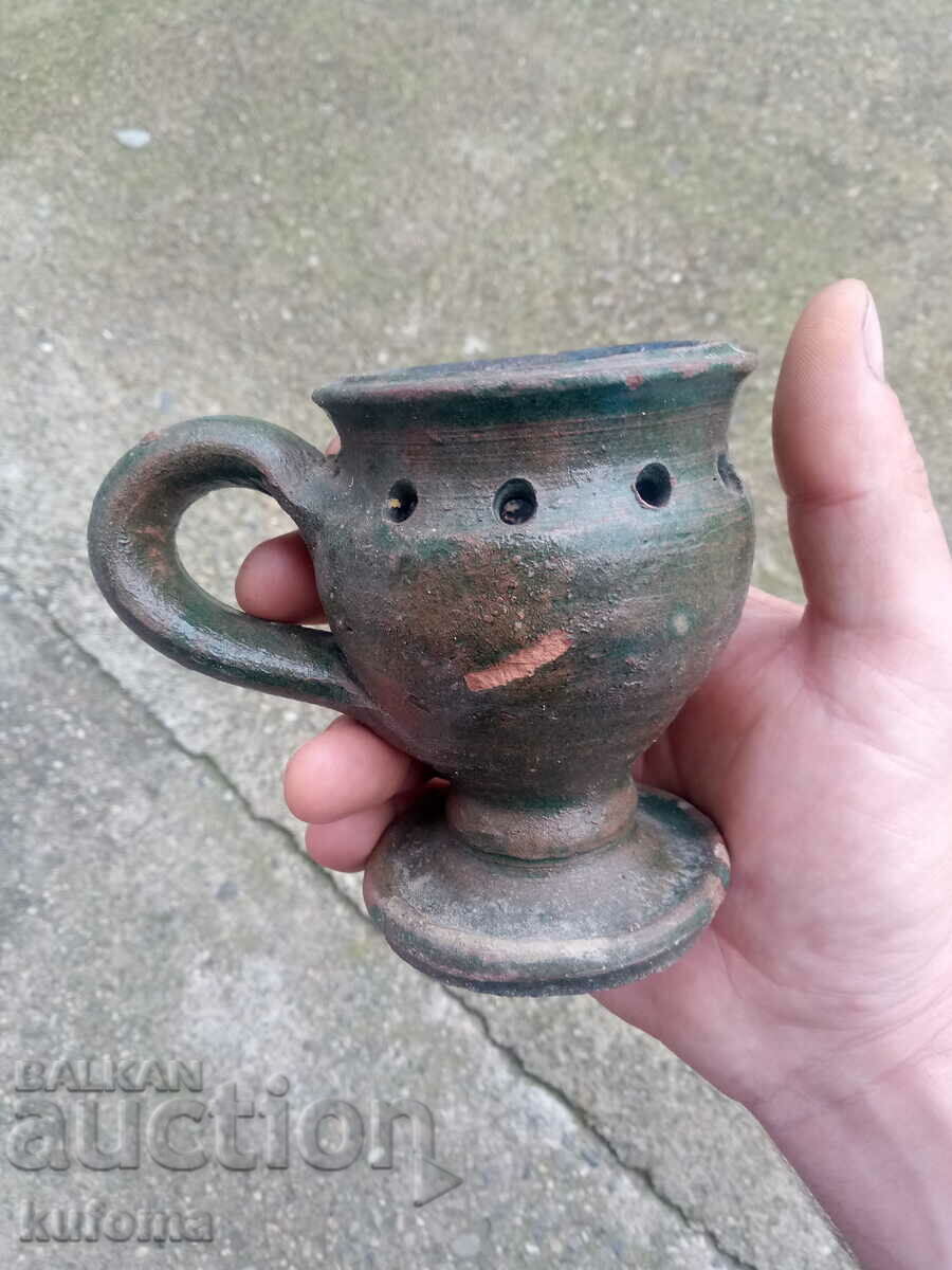 An old ceramic candela