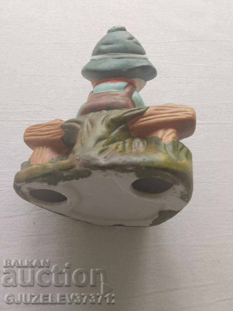 Delivery of Porcelain figure of a Dutch boy playing an accordion Delivery of Porcelain figure of a Dutch boy playing an accordion