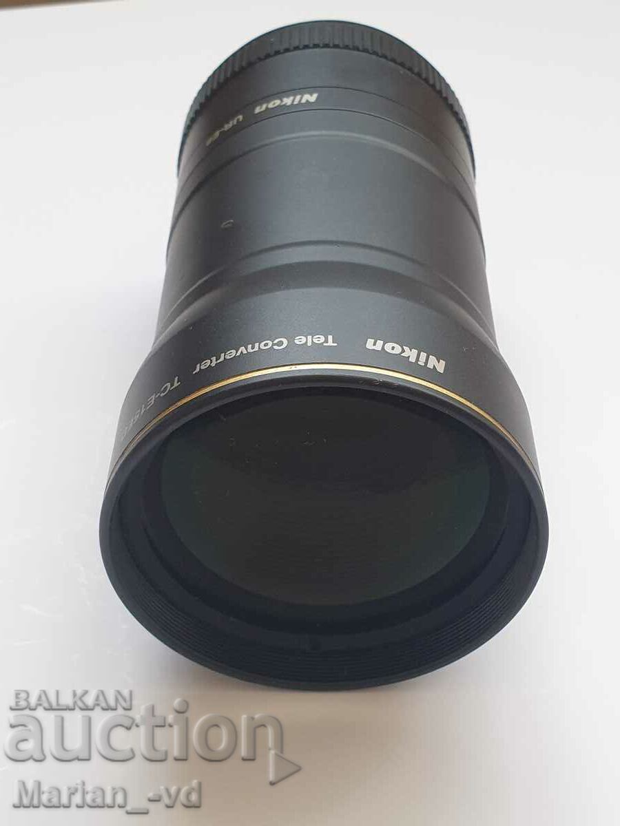 Nikon TC-E15ED 1.5x lens and Nikon UR-E8 adapter ring