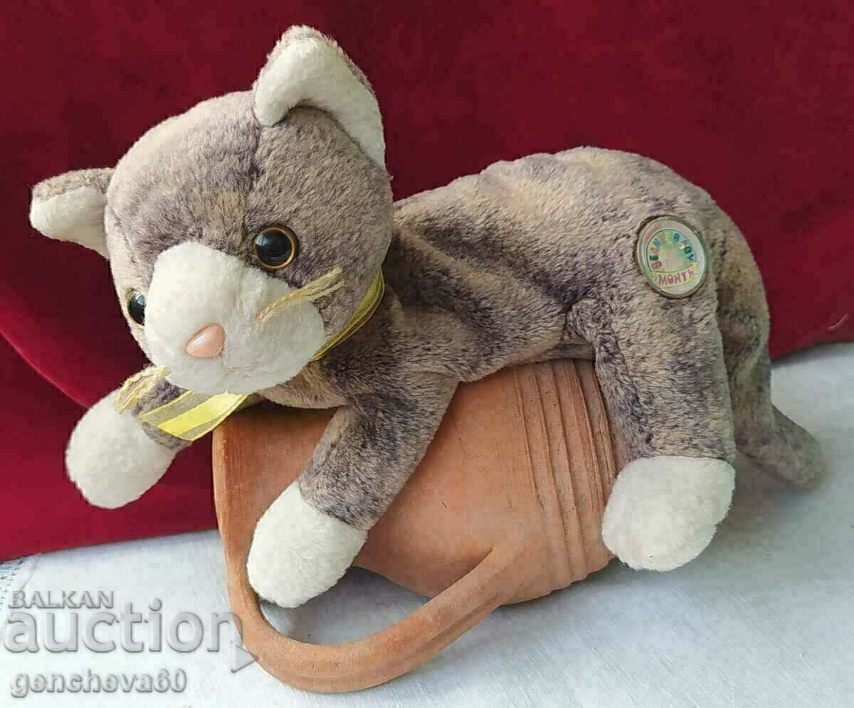 Collectible plush kitten and ceramic amphora Collectible plush kitten and ceramic amphora