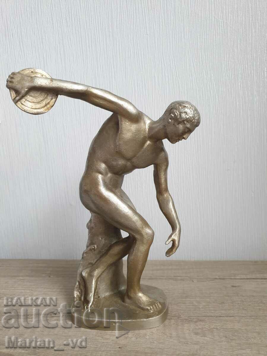 Delivery of Old large aluminum figure of a discus thrower