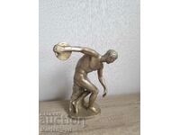 Old large aluminum figure of a discus thrower