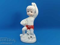 Porcelain figure of a child with a ball