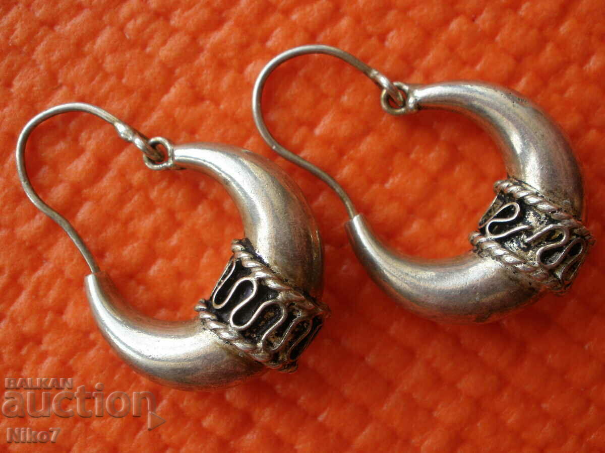 Old, silver-plated earrings.