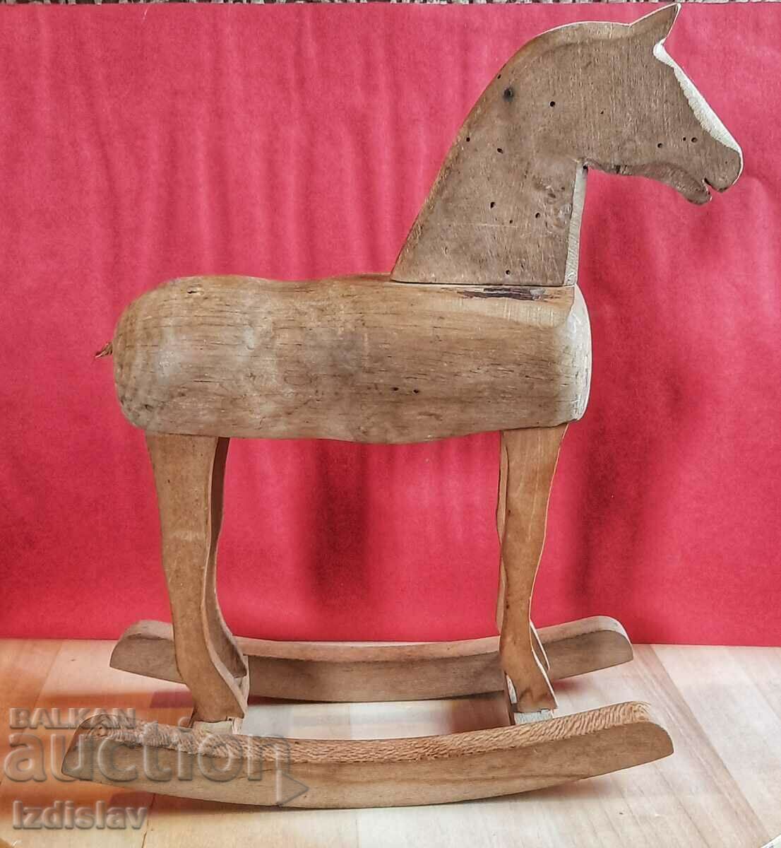 Vintage wooden toy rocking horse.