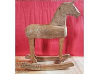 Vintage wooden toy rocking horse.