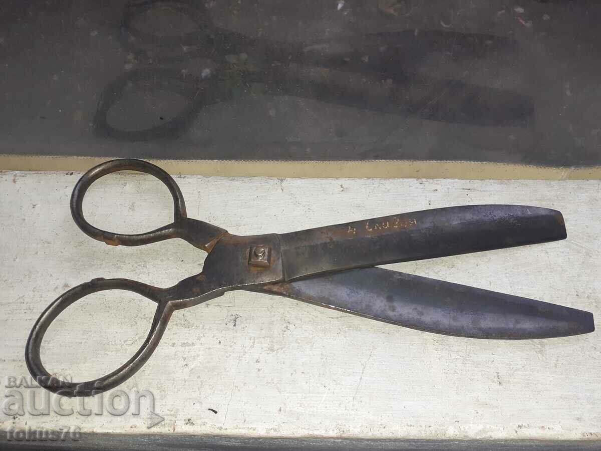 Old forged Renaissance scissors with gold studs