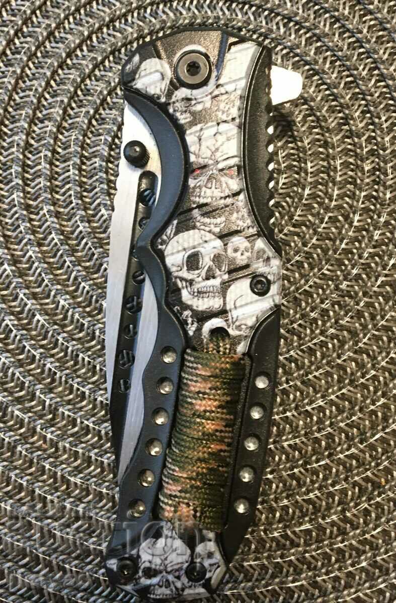 Folding automatic knife design with skull + paracode 9.5 x 215 with price 19.50 BGN | € 9.97 Folding automatic knife design with skull + paracode 9.5 x 215 with price 19.50 BGN | € 9.97