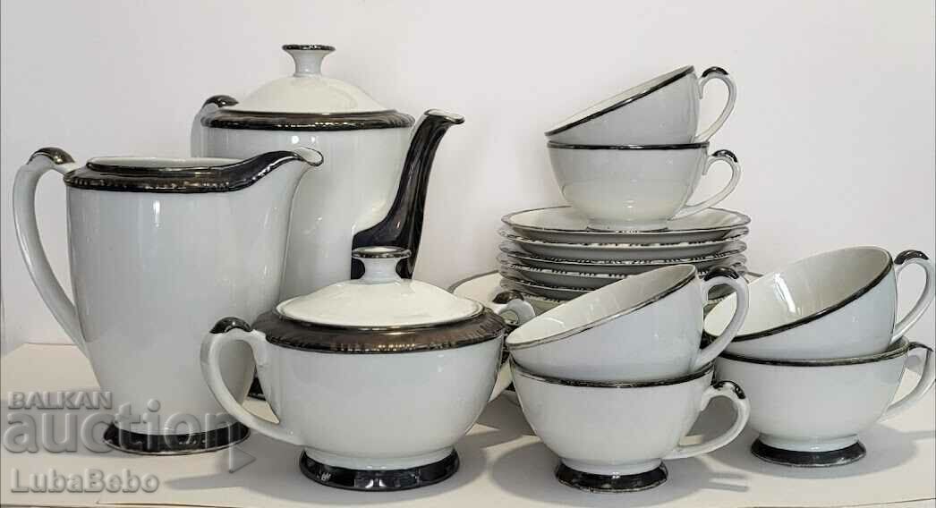 Coffee service with sterling silver edges.
