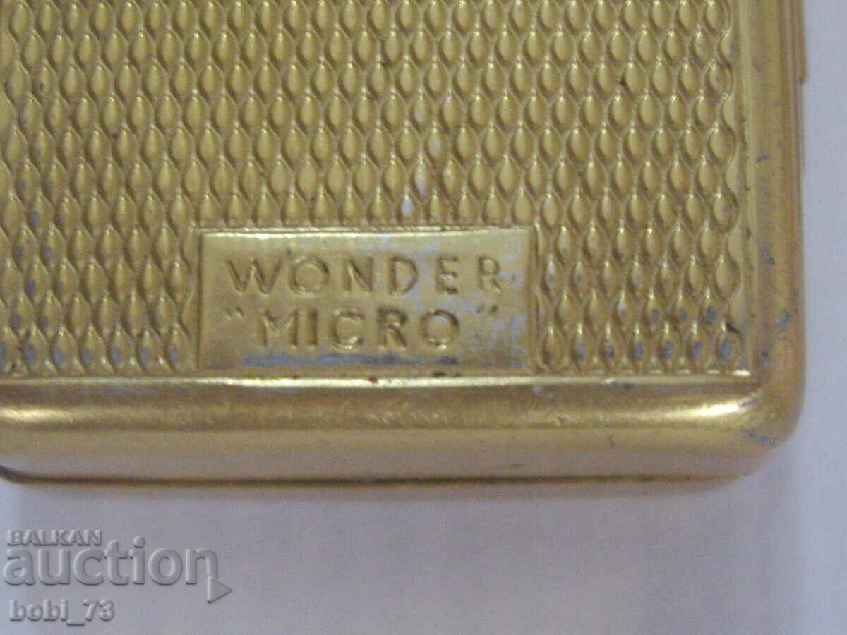 Delivery of Old gilded small spotlight.