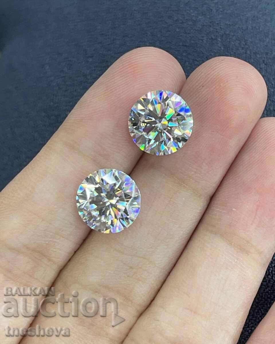 A pair of moissanites with a certificate