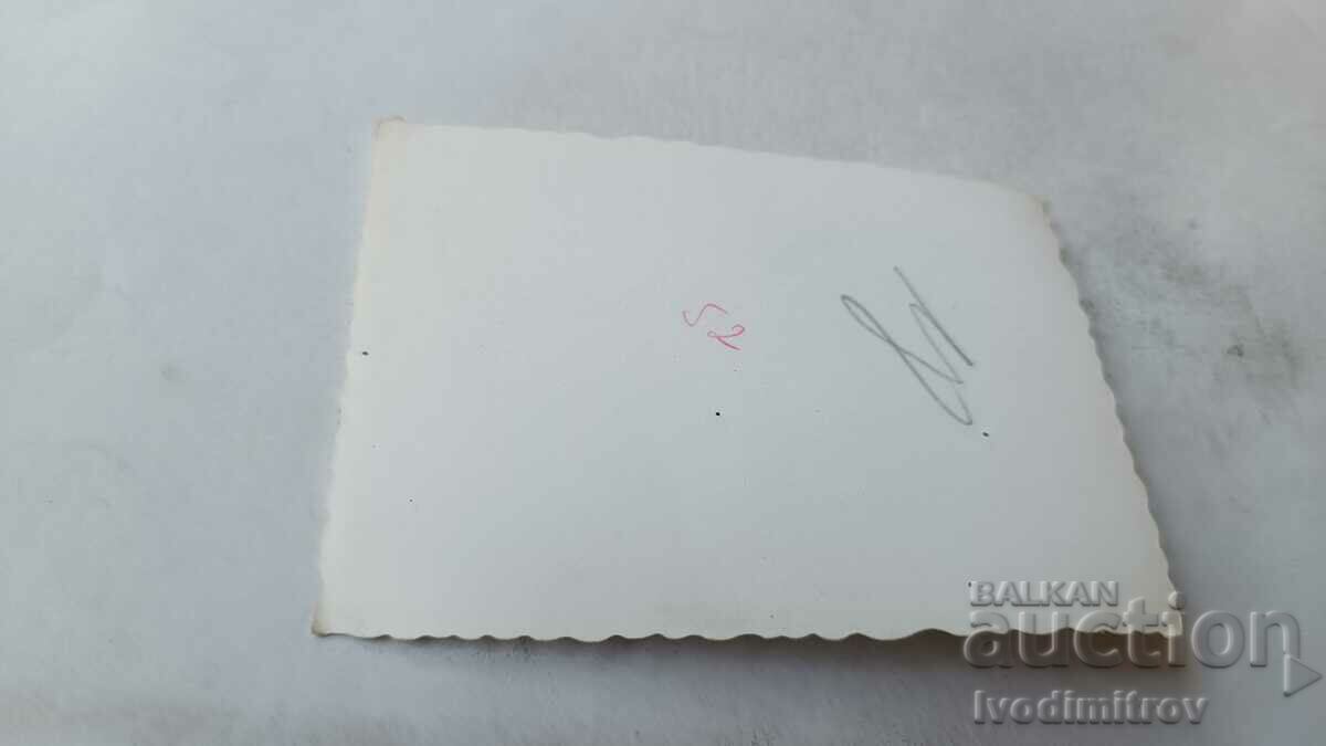 Photo Two young men and women on the beach with price 1.75 BGN | € 0.89