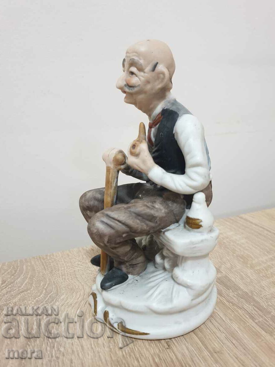 Porcelain figure of an old man with a pipe with price 28.00 BGN | € 14.32 Porcelain figure of an old man with a pipe with price 28.00 BGN | € 14.32