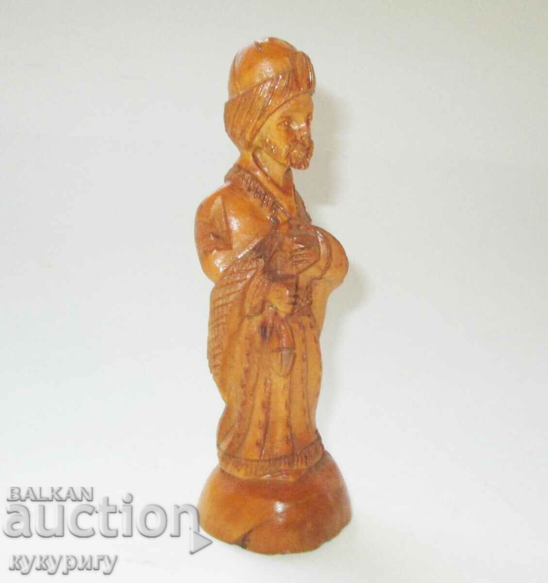 Old wooden figure statuette carving