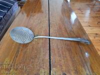 Old slotted spoon, stirrer