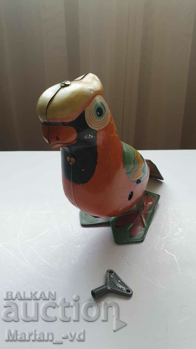 Old tin toy parrot with price 100.00 BGN | € 51.13 Old tin toy parrot with price 100.00 BGN | € 51.13