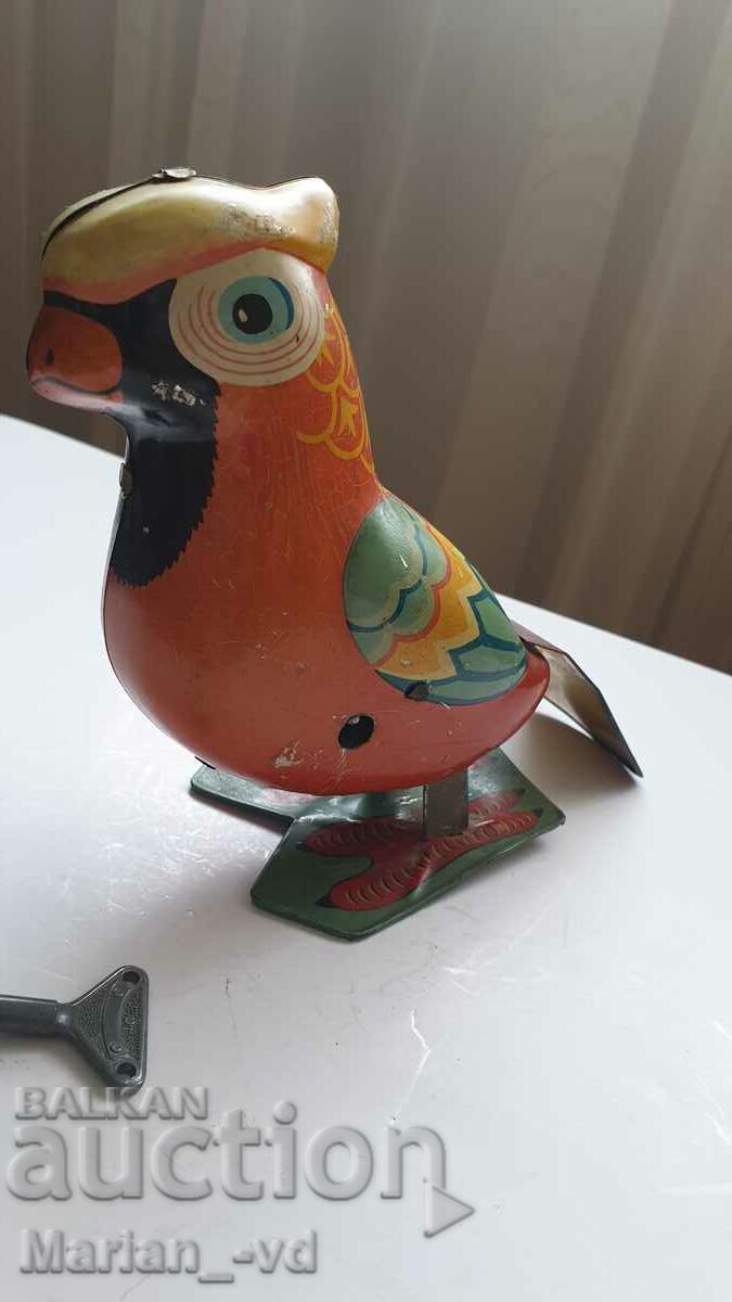 Auction Old tin toy parrot Auction Old tin toy parrot