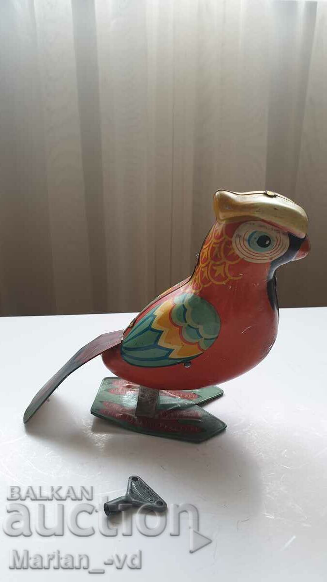 Delivery of Old tin toy parrot Delivery of Old tin toy parrot