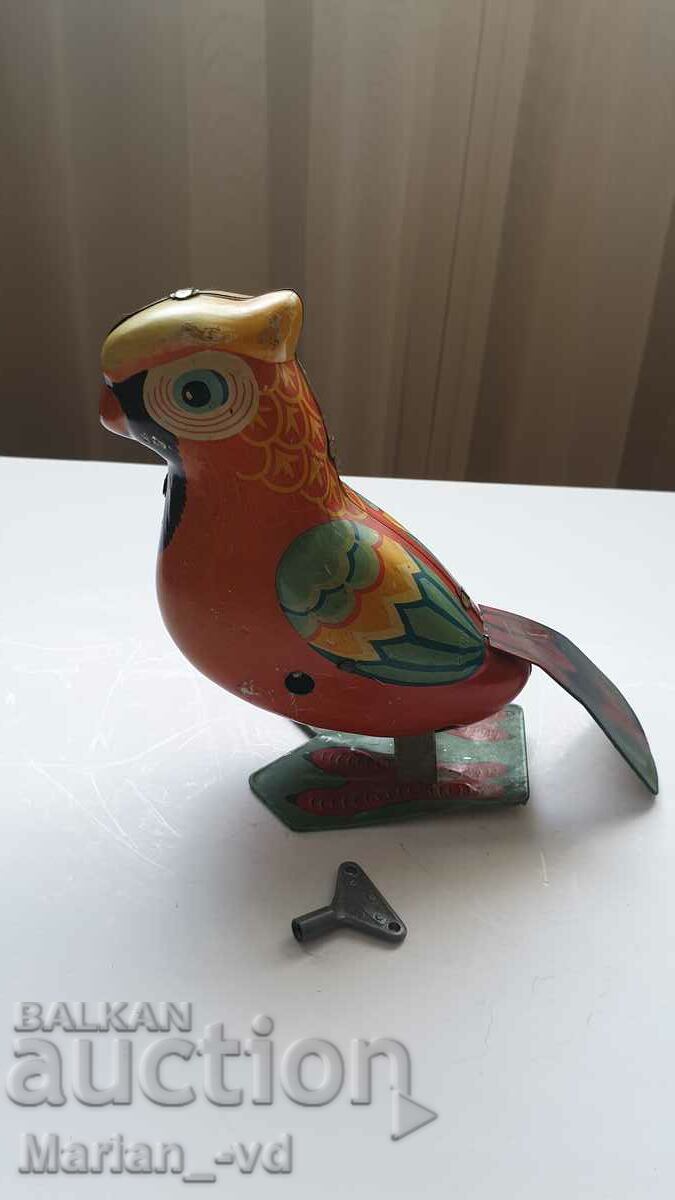 Papagal vechi de jucărie din tablă