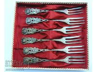 A set of old very thick silver plated forks
