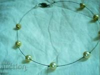 old beautiful necklace of natural pearls with a magnetic chain